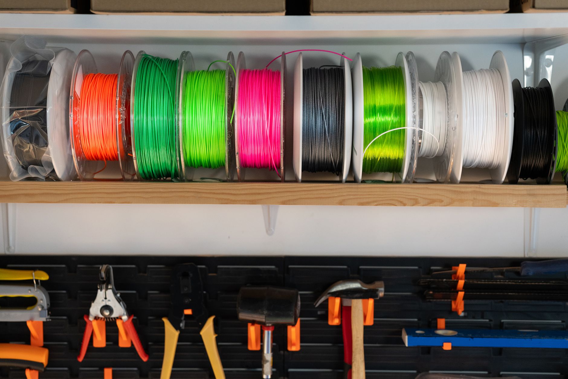 A presenter discusses 3D printing use cases with a small group indoors.