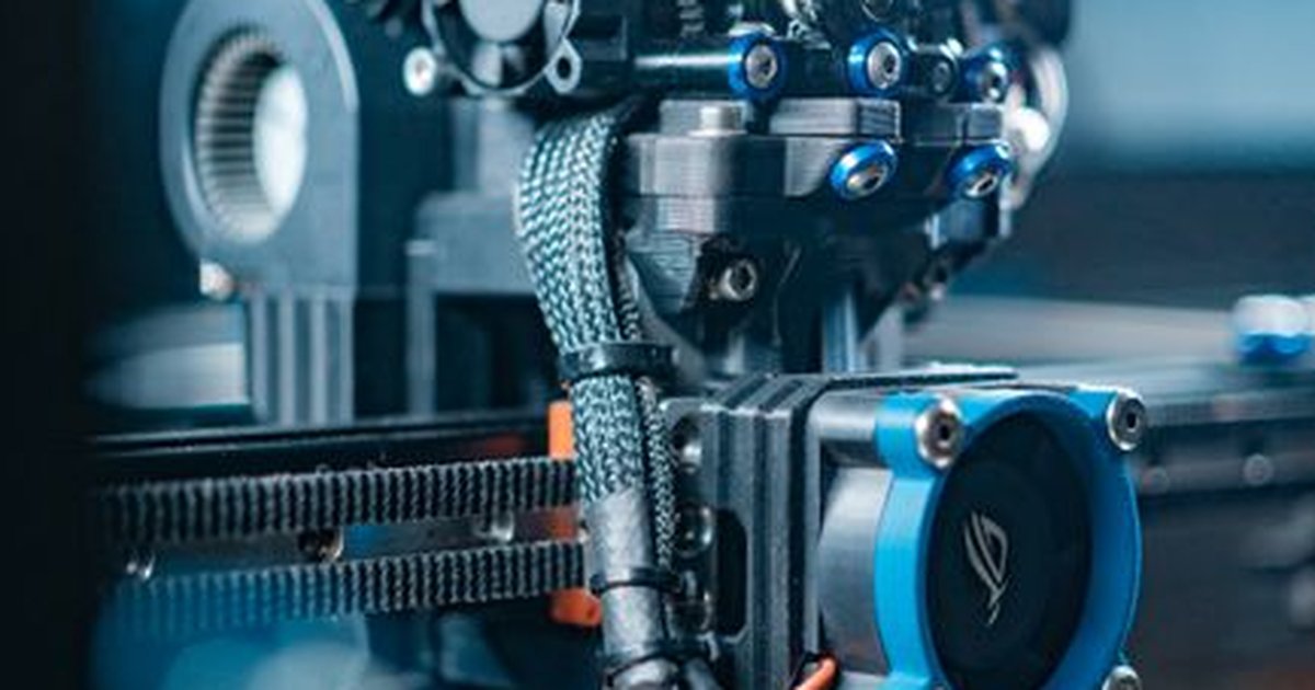 Close-up view of a high-tech 3D printer in operation, capturing detailed mechanics.