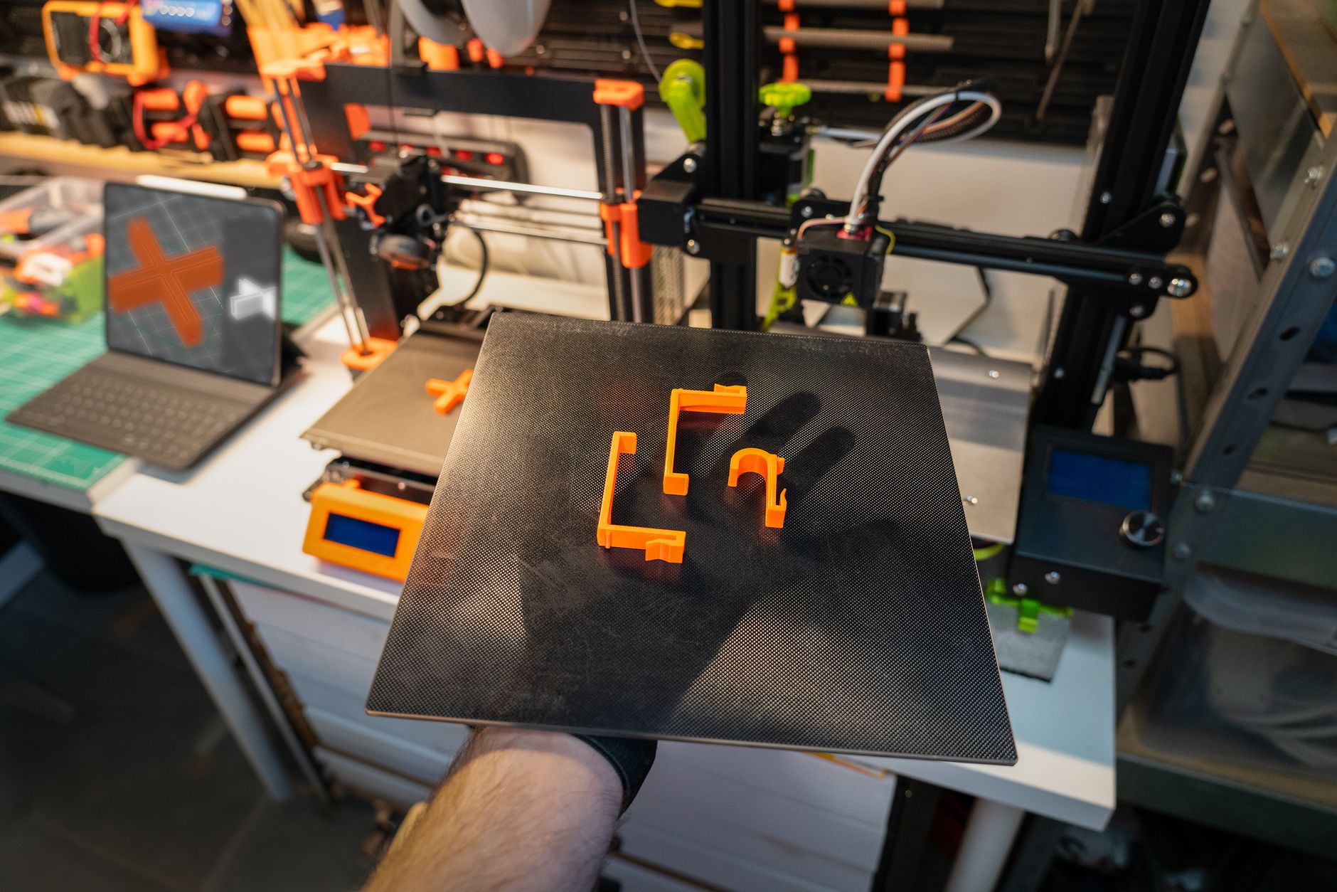 3D printer crafting Santa Claus figures with red hats, capturing modern holiday manufacturing.