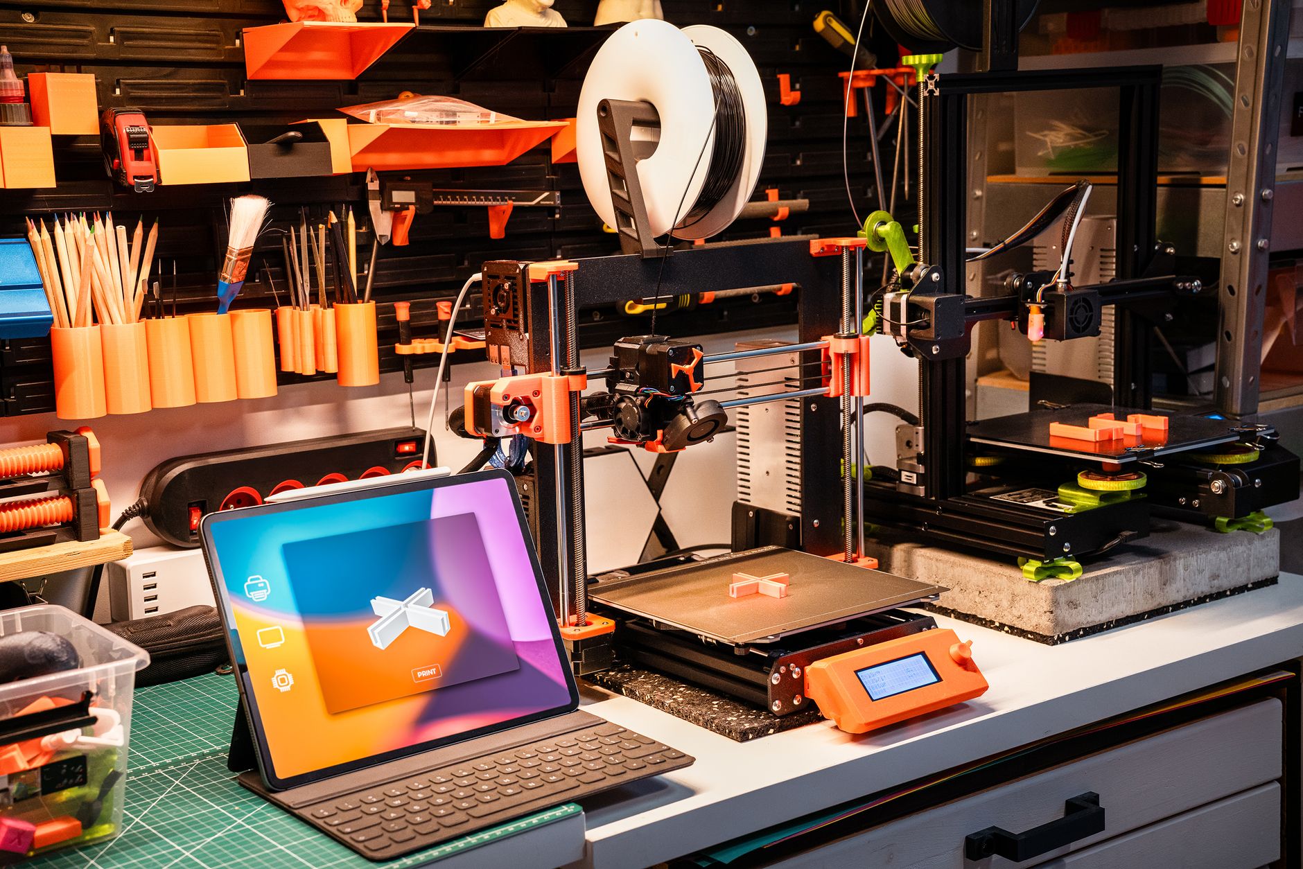 Detailed close-up of a 3D printer extruding red plastic during operation.