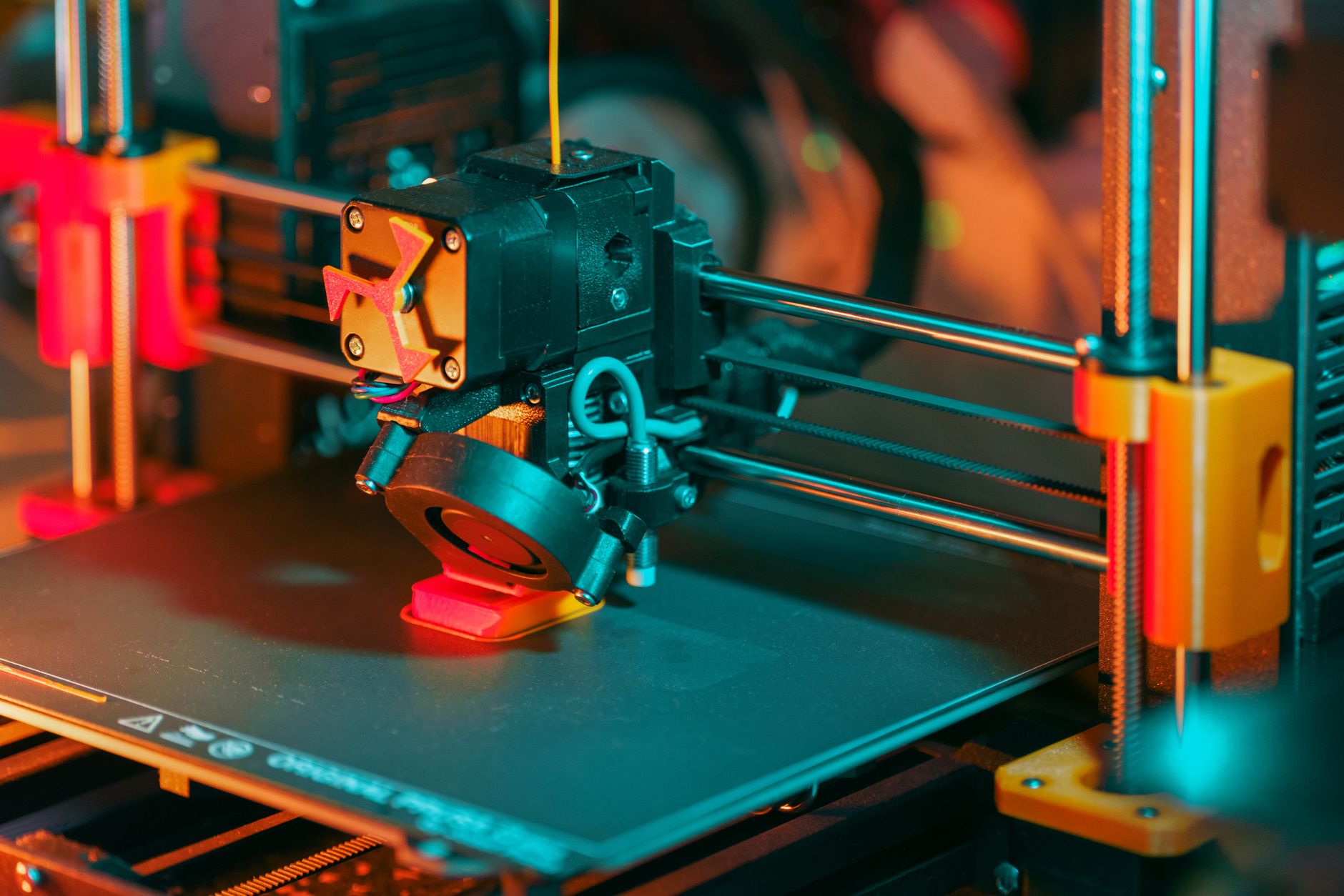 Detailed view of a 3D printer extruder, showcasing modern technology and precision.