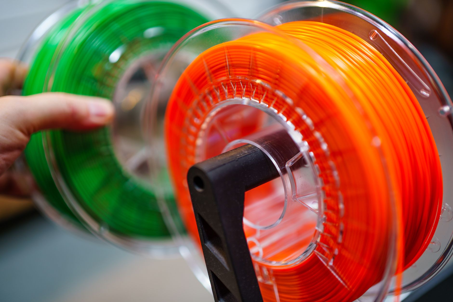 A top-down view of assorted colorful thread spools organized neatly for sewing projects.